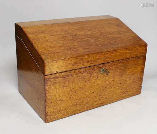 A 19th century oak stationery casket, with a sectional fitte...