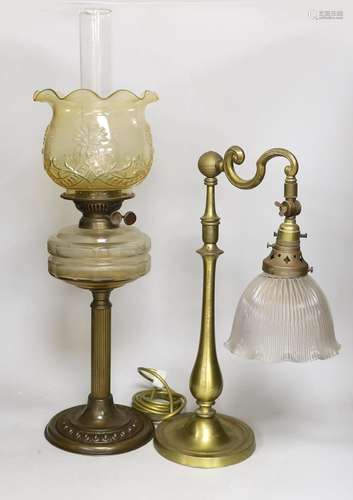 An Edwardian brass desk lamp with glass shade and a Victoria...