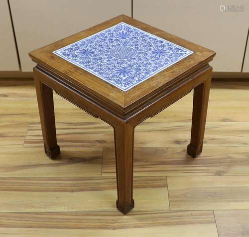 A Chinese hardwood and blue and white porcelain inset table,...