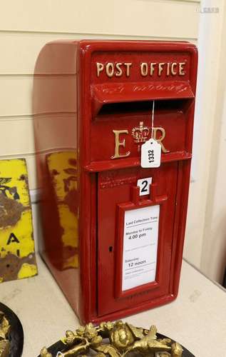 A Queen Elizabeth II red painted post box, 57cm tall