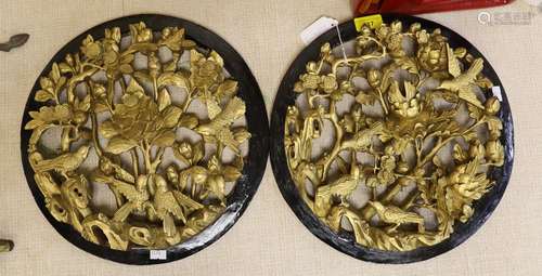 A pair of Chinese carved and gilded wood birds and flowers r...