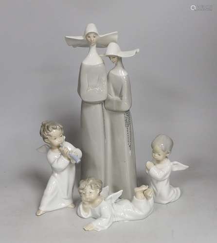 A selection of four assorted Lladro ceramic figures. Tallest...