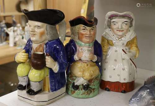 A group of three 19th century Toby jugs. Tallest 24cm