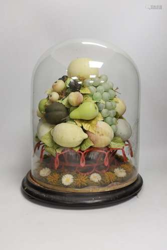 A Victorian wax fruit and woolwork arrangement under a glass...