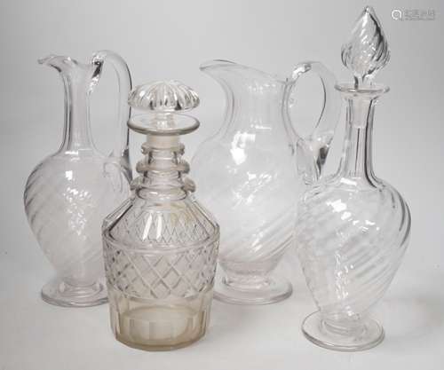 Two Victorian cut glass decanters, a ewer and a jug. Tallest...