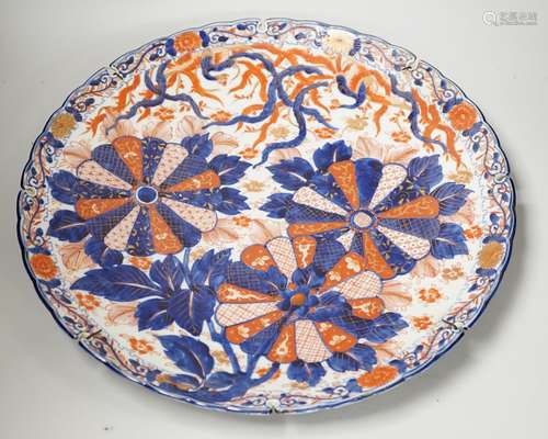 An Imari petal rimmed charger, in typical palette, Meiji per...