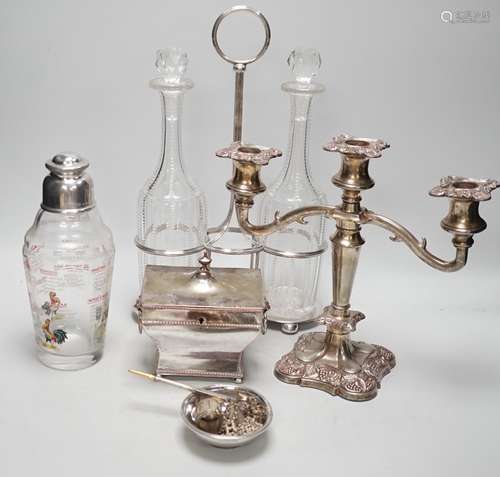 Assorted plated items including a decanter stand with two bo...