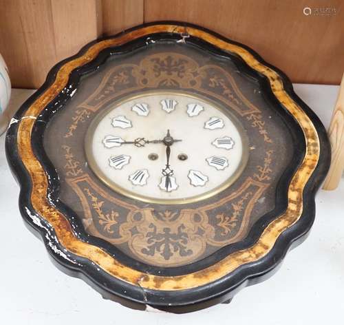 A late 19th century oval French marquetry wall clock with en...