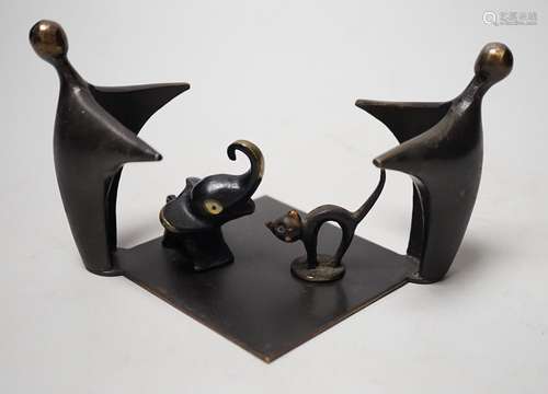 An abstract bronze group, 19cm wide, together with two other...