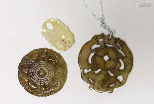 Three Chinese carved hardstone pendants