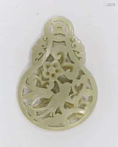 A Chinese celadon jade reticulated pendant. 7cm tall