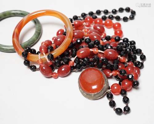 A spinach green Jade bangle and hardstone bead necklaces