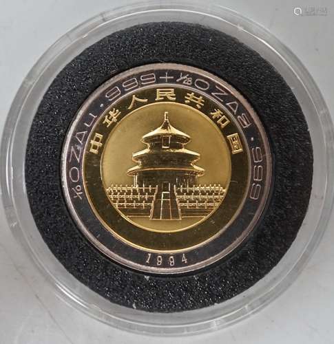 A Chinese Panda gold and silver 10 Yuan coin