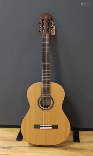 An Admira Concerto classical guitar. Cedar top, satin finish...