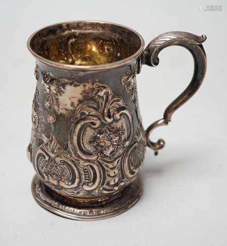 A George III silver small mug, with later embossed decoratio...