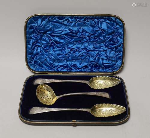 A cased set of two George III parcel gilt silver spoons and ...