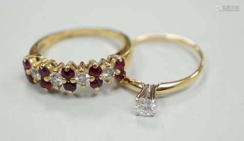 A modern 18ct gold, ruby and diamond cluster set half hoop r...