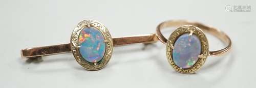 A 9ct and black opal doublet set bar brooch, 38mm and a matc...