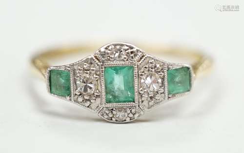 A 1920s 18ct & plat, millegrain set three stone emerald ...