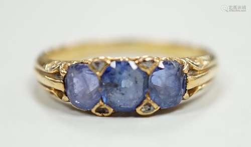 An early 20th century 18ct and three stone sapphire set half...