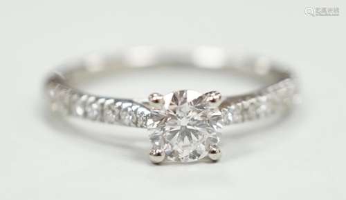 A modern platinum and single stone diamond ring, with diamon...