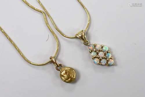 A modern 585 and white opal cluster set diamond shaped penda...