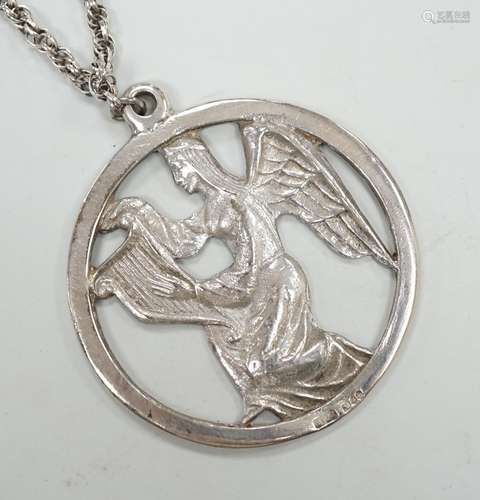 A late 1970s John Skelton silver pendant, depicting an angel...