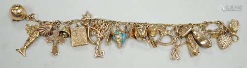 A 9ct charm bracelet, hung with assorted mainly 9ct gold cha...