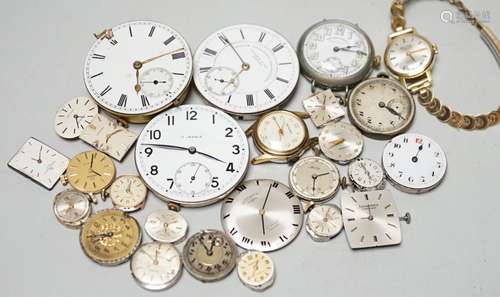 A collection of assorted wrist and pocket watch parts.