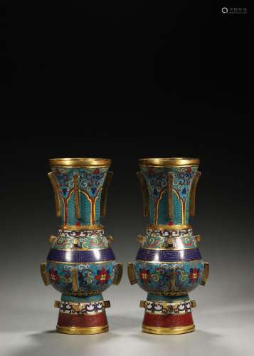 A pair of interlocking flower patterned cloisonne vases