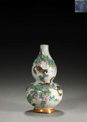 A famille rose squirrel and grape patterned gourd-shaped por...