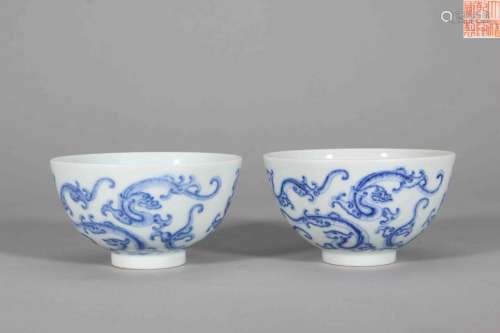 A pair of blue and white dragon porcelain bowls