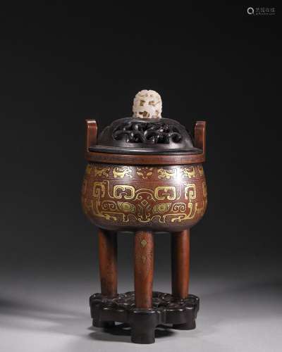 A taotie patterned gold and silver-inlaid bronze pot