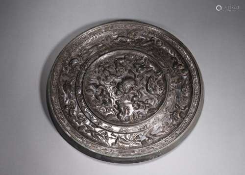 A sea beast and grape patterned bronze mirror