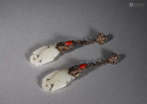 A pair of jade fish earrings