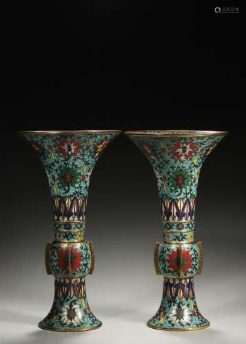 A pair of interlocking flower patterned cloisonne beaker vas...