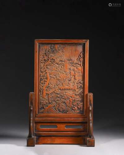 A figure carved bamboo screen
