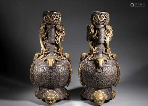 A pair of dragon patterned double-eared gilding silver vases