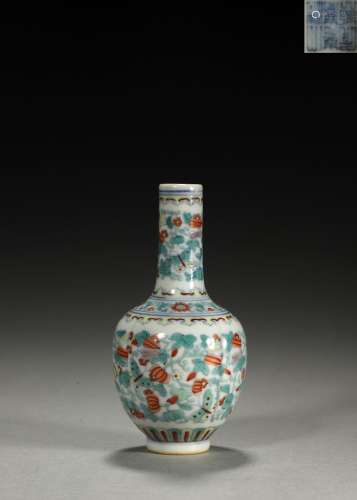 A doucai fruit and butterfly patterned porcelain vase