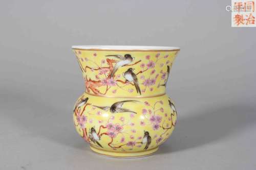 A yellow ground famille rose magpie and plum blossom porcela...
