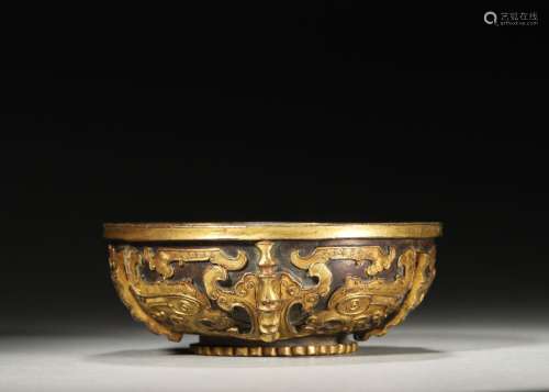 A beast face patterned gilding copper bowl