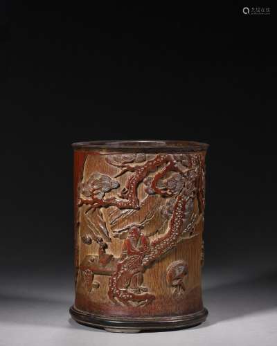 A figure and crane carved bamboo brush pot