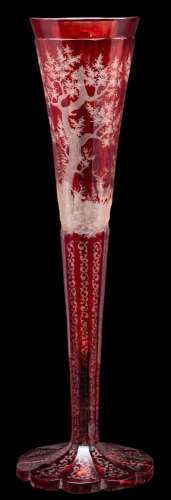 A Bohemian red overlay glass vase, of faceted trumpet shaped...