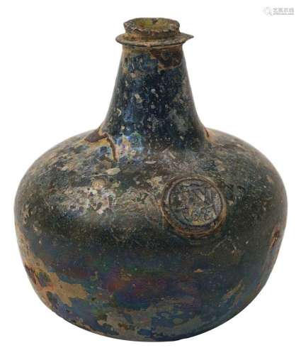 A sealed transitional onion wine bottle dated 1687, of dark ...