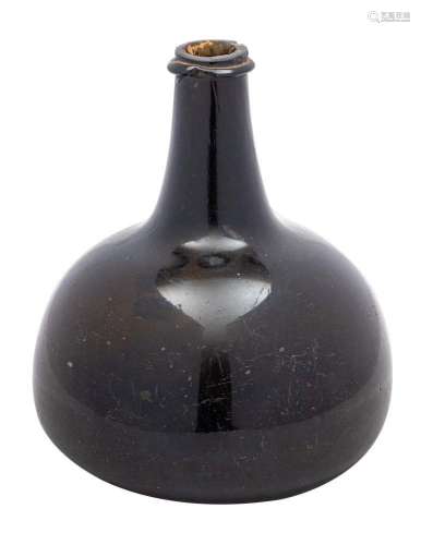 A transitional/mallet form wine bottle of green amber hue wi...