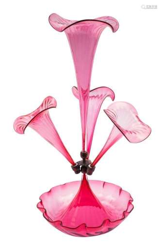 A cranberry glass epergne with central trumpet shape vase fl...