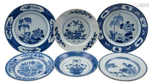 A group of six Chinese blue and white plates variously paint...