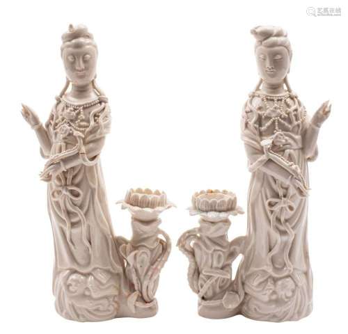 A pair of Chinese blanc de chine figures of Guanyin each wea...