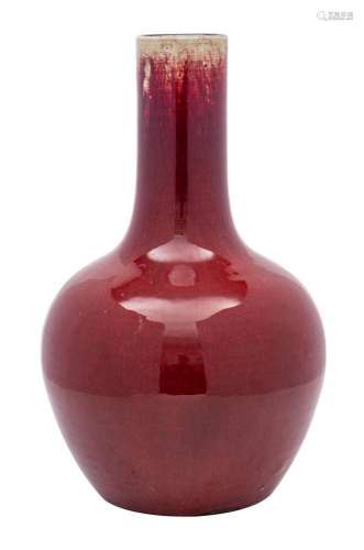 A Chinese flambé bottle vase the rich ox-blood glaze turning...