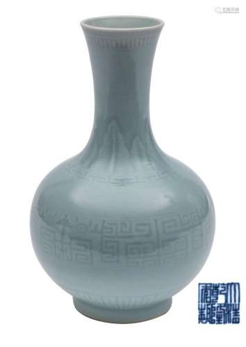 A Chinese bottle vase the pale greenish-blue glaze decorated...